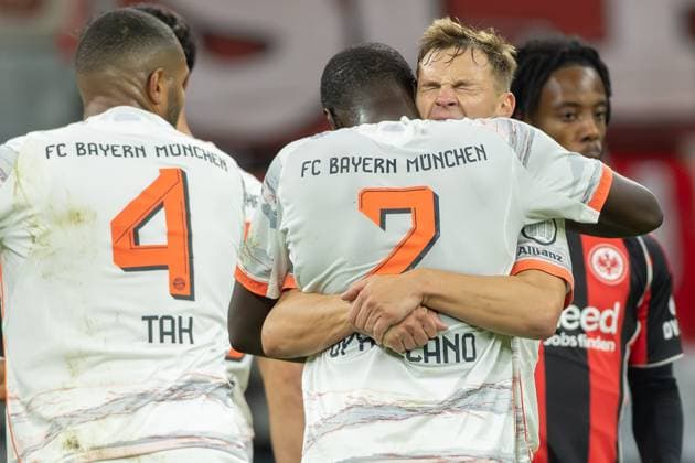 Eintracht Frankfurt FC Bayern Munich, 1 FBL After the final whistle Joshua Kimmich Bayern Munich, 6 hugs his teammate Dayot Upamecano Bayern Munich, 2 passionately left Jonathan Tah Bayern Munich, 4 Bundesliga match between Eintracht Frankfurt and FC Bayern Munich on October 4, 2025 at Deutsche Bank Park in Frankfurt am Main , Frankfurt am Main Hessen Germany Deutsche Bank Park