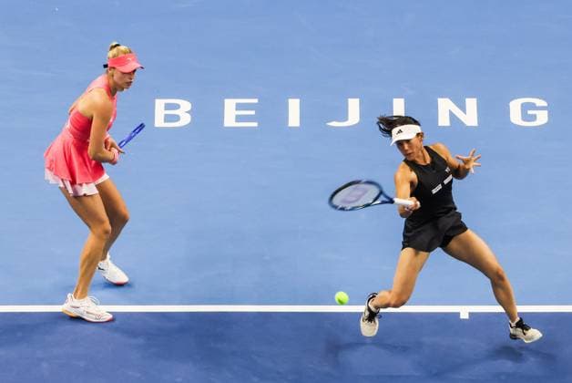 BEIJING, CHINA - OCTOBER 05: Miyu Kato of Japan and Fanny Stollar of Hungary return a shot in the Women s Doubles Final match against Sara Errani and Jasmine Paolini of Italy on day 14 of the 2025 China Open at the National Tennis Center on October 5, 2025 in Beijing, China.  Copyright: xVCGx 111595191747