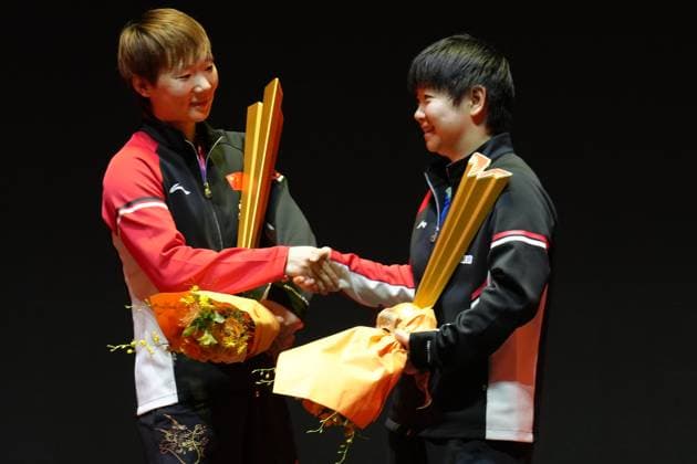 BEIJING, CHINA - OCTOBER 05: Champion Wang Manyu (L) of China shakes hands with runner-up Sun Yingsha of China during the medal ceremony following the Women s Singles Final match on day 11 of the WTT China Smash 2025 at Shougang Park on October 5, 2025 in Beijing, China.  Copyright: xVCGx 111595205627