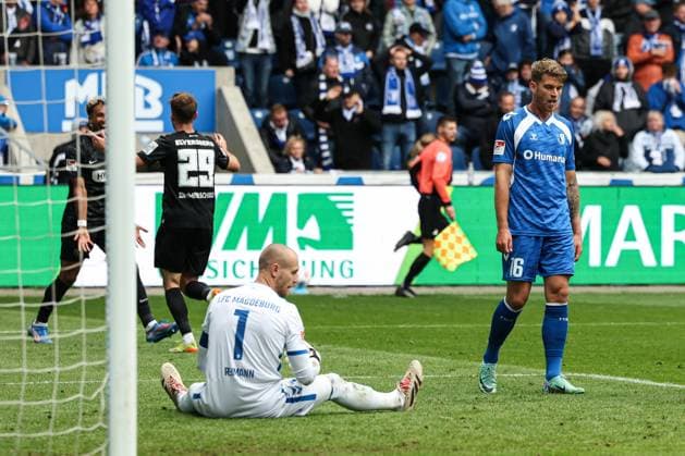 Marcus Mathisen 1 FC Magdeburg,16 and goalkeeper Dominik Reimann 1 FC Magdeburg,1 Goalscorer Tom Zimmerschied SV Elversberg,29 scores to 0 2 2 Soccer Bundesliga Season 2025 2026 1 FC Magdeburg vs SV 07 Elversberg at the Avnet Arena in Magdeburg Action,Soccer,Man,Men,Germany,05 10 2025