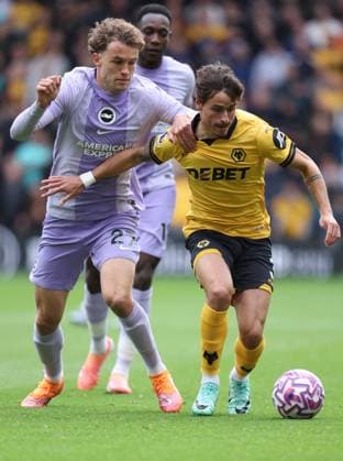 Wolverhampton Wanderers v Brighton & Hove Albion - Premier League Mats Wieffer of Brighton and Hove Albion and Hugo Bueno of Wolverhampton Wanderers challenge during the Premier League match between Wolverhampton Wanderers and Brighton & Hove Albion at Molineux on October 5, 2025 in Wolverhampton, England. Wolverhampton Molineux England United Kingdom Copyright: xNealxSimpson Sportsphoto APLx 14137313