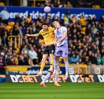 5th October 2025; Molineux Stadium, Wolverhampton, West Midlands, England; Premier League Football, Wolverhampton Wanderers versus Brighton and Hove Albion; Jorgen Strand Larsen of Wolverhampton Wanderers competes with Jan Paul van Hecke of Brighton in the air  GodfreyxPitt