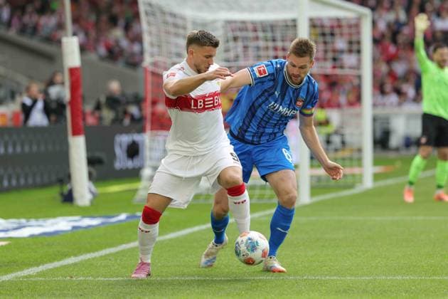 Stuttgart , Bundesliga Soccer VfB Stuttgart vs 1 FC Heidenheim, f l Ermedin Demirovic VfB Patrick Mainka Heidenheim According to the regulations of the DFL German Soccer League, it is prohibited to use or have used photographs taken in the stadium and or of the match in the form of sequential images and or video-like photo series