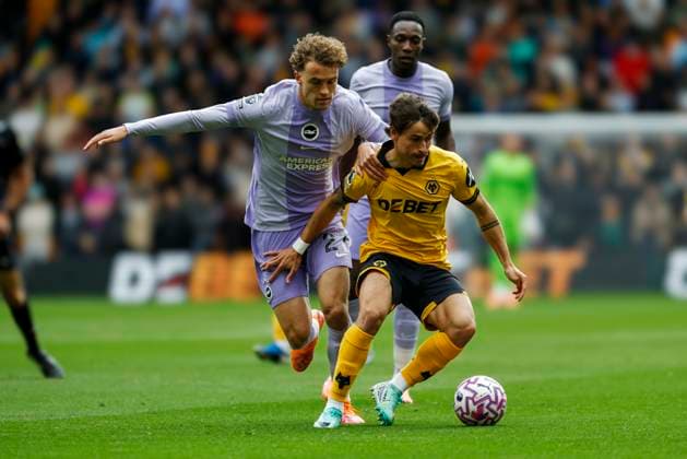 Wolverhampton Wanderers v Brighton and Hove Albion Premier League Matts Wieffer of Brighton and Hove Albion challenges for the ball with Hugo Bueno of Wolverhampton Wanderers during the Premier League match at Molineux, Wolverhampton UK Newspapers OUT Copyright: xJackxTylerx FIL-22325-0076