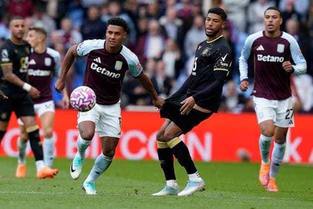 Birmingham, England, 5th October 2025. Ollie Watkins of Aston Villa (L) is challenged by Josh Laurent of Burnley during the Aston Villa vs Burnley Premier League match at Villa Park, Birmingham. Picture credit should read: Andrew Yates Sportimage EDITORIAL USE ONLY. No use with unauthorised audio, video, data, fixture lists, club league logos or live services. Online in-match use limited to 120 images, no video emulation. No use in betting, games or single club league player publications. SPI_0120_AY_VILLA_BURNLEY SPI-4198-0020