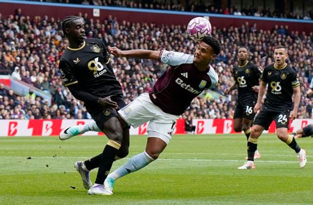 Birmingham, England, 5th October 2025. Ollie Watkins of Aston Villa (C) is challenged by Axel Tuanzebe of Burnley during the Aston Villa vs Burnley Premier League match at Villa Park, Birmingham. Picture credit should read: Andrew Yates Sportimage EDITORIAL USE ONLY. No use with unauthorised audio, video, data, fixture lists, club league logos or live services. Online in-match use limited to 120 images, no video emulation. No use in betting, games or single club league player publications. SPI_019_AY_VILLA_BURNLEY SPI-4198-0019