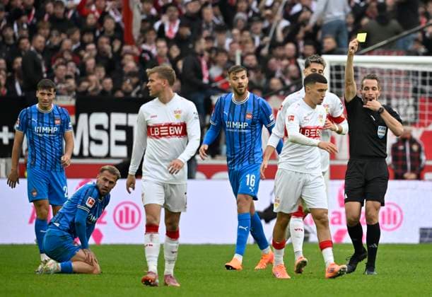 after tackle, action foul Bilal El Khannouss VfB Stuttgart 11 v Niklas Dorsch 1 FC Heidenheim 1846 FCH 30 shows referee Referee Tobias Stieler yellow card yellow caution VfB Stuttgart v 1 FC Heidenheim FCH 05 10 2025 DFL REGULATIONS PROHIBIT ANY USE OF PHOTOGRAPHS AS IMAGE SEQUENCES AND OR QUASI VIDEO VfB Stuttgart v 1 FC Heidenheim FCH