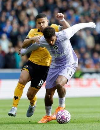 Wolverhampton Wanderers v Brighton and Hove Albion Premier League Joao Gomes of Wolverhampton Wanderers challenges for the ball with Georginio Rutter of Brighton and Hove Albion during the Premier League match at Molineux, Wolverhampton UK Newspapers OUT Copyright: xJackxTylerx FIL-22325-0101