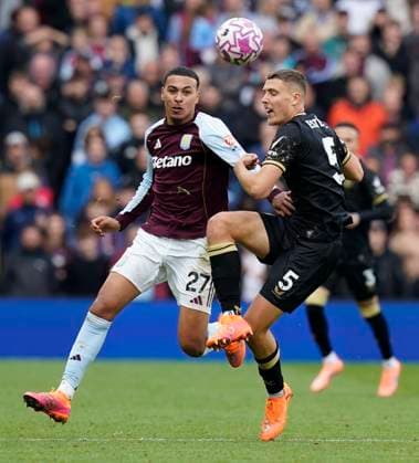 Birmingham, England, 5th October 2025. Morgan Rogers of Aston Villa (L) challenges Maxime Esteve of Burnley during the Aston Villa vs Burnley Premier League match at Villa Park, Birmingham. Picture credit should read: Andrew Yates Sportimage EDITORIAL USE ONLY. No use with unauthorised audio, video, data, fixture lists, club league logos or live services. Online in-match use limited to 120 images, no video emulation. No use in betting, games or single club league player publications. SPI_032_AY_VILLA_BURNLEY SPI-4198-0032