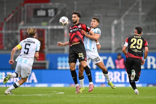 Nikolas Agrafiotis SV Wehen Wiesbaden, 25 in duel with Sean Dulic TSV 1860 Muenchen, 25 , GER, SV Wehen Wiesbaden vs TSV 1860 München, Soccer, 3 Liga, Matchday 10, Season 2025 2026, 05 10 2025 DFB REGULATES PROHIBIT ANY USE OF PHOTOGRAPHS AS IMAGE SEQUENCES AND OR QUASI VIDEO GER, SV Wehen Wiesbaden vs TSV 1860 Munich, Football, 3 Liga, Matchday 10, Season 2025 2026, 05 10 2025 Wiesbaden Copyright: xEibner-Pressefoto FlorianxWiegandx EP_FWD