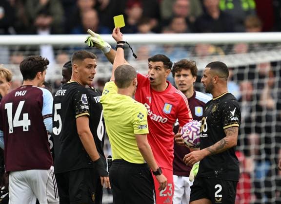 Emiliano Martinez goalkeeper of Aston Villa is show a yellow card by referee Andrew Kitchen Aston Villa v Burnley, Premier League, Football, Villa Park, Birmingham, UK - 05 Oct 2025Birmingham Villa Park United Kingdom EDITORIAL USE ONLY No use with unauthorised audio, video, data, fixture lists, club league logos or live services. Online in-match use limited to 120 images, no video emulation. No use in betting, games or single club league player publications. Copyright: xAnnaxGowthorpe Shutterstockx 15515860ao