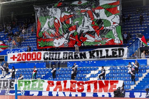 Deportivo Alaves v Elche - La Liga VITORIA-GASTEIZ - OCTOBER 05: Fans of Deportivo Alaves display banners in support of Palestinians, carry dolls wrapped in blood-red shrouds to represent children lost their lives in Gaza, drawing attention to the humanitarian crisis, during the Week 8 fixture of the Spanish La Liga, where Deportivo Alaves face Elche at Mendizorrotza Stadium in Vitoria-Gasteiz, Spain on October 05, 2025. Pablo Garcia Anadolu Vitoria-Gasteiz Spain. Editorial use only. Please get in touch for any other usage.  Copyright: x2025xAnadoluxPabloxGarciax