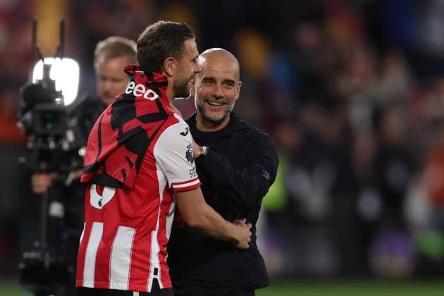 London, England, 5th October 2025. Jordan Henderson of Brentford and Josep Guardiola, Manager of Manchester City after the Brentford vs Manchester City Premier League match at Gtech Community Stadium, London. Picture credit should read: Paul Terry Sportimage EDITORIAL USE ONLY. No use with unauthorised audio, video, data, fixture lists, club league logos or live services. Online in-match use limited to 120 images, no video emulation. No use in betting, games or single club league player publications. SPI_041_PT_Brentford_Man_City SPI-4202-0041