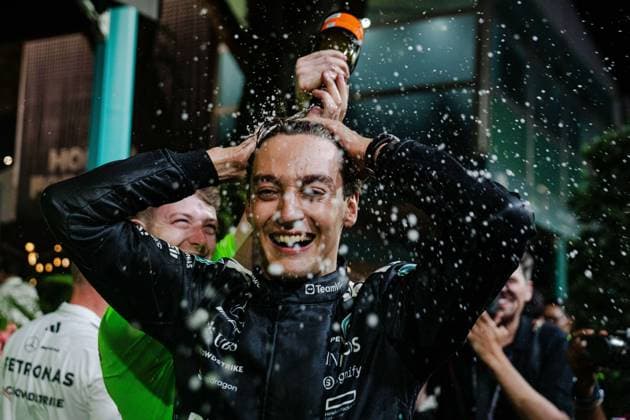 Formula 1 Singapore Grand Prix 2025 George Russell 63 (GBR) Mercedes F1 W16 Paddock Celebration with champagne during the Formula 1 Singapore Airlines Singapore Grand Prix 2025 at the Marina Bay Street Circuit, Singapore on 5 October 2025 Credit: Jun Da Tan Every Second Media Editorial use only. All images are copyright Every Second Media Limited. No images may be reproduced without prior permission. Copyright: xIMAGO EveryxSecondxMediax ESM-1610-0133 JunxDaxTanx xEveryxSecondxMediax