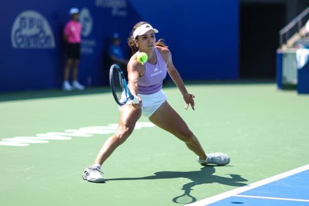 WUHAN, CHINA - OCTOBER 06: Camila Osorio of Colombia returns a shot in the Women s Singles Round of 64 match against Marie Bouzkova of Czech Republic on day 3 of 2025 Wuhan Open at Optics Valley International Tennis Center on October 6, 2025 in Wuhan, Hubei Province of China.  Copyright: xVCGx 111595402147