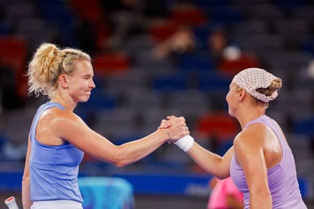 WUHAN, CHINA - OCTOBER 06: Diana Shnaider (R) shakes hands with Katerina Siniakova of Czech Republic in the Women s Singles Round of 64 match on day 3 of 2025 Wuhan Open at Optics Valley International Tennis Center on October 6, 2025 in Wuhan, Hubei Province of China.  Copyright: xVCGx 111595400566