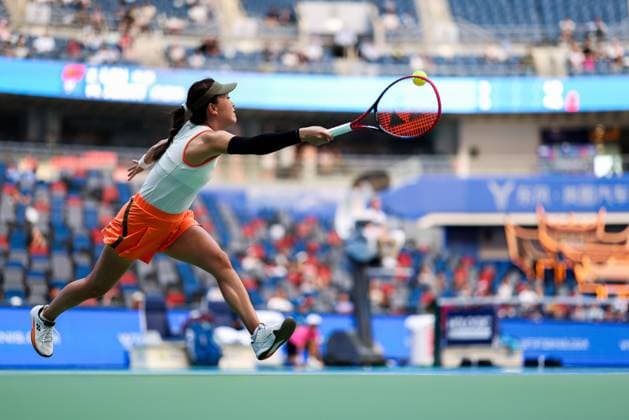 WUHAN, CHINA - OCTOBER 06: Zhu Lin of China returns a shot in the Women s Singles Round of 64 match against Maya Joint of Australia on day 3 of 2025 Wuhan Open at Optics Valley International Tennis Center on October 6, 2025 in Wuhan, Hubei Province of China.  Copyright: xVCGx 111595410704