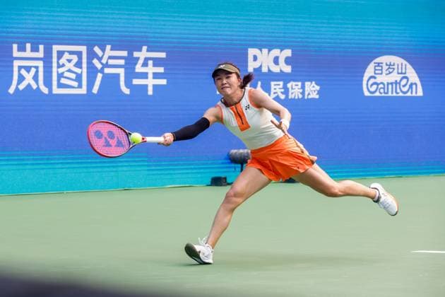 WUHAN, CHINA - OCTOBER 06: Zhu Lin of China returns a shot in the Women s Singles Round of 64 match against Maya Joint of Australia on day 3 of 2025 Wuhan Open at Optics Valley International Tennis Center on October 6, 2025 in Wuhan, Hubei Province of China.  Copyright: xVCGx 111595410686
