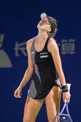 WUHAN, CHINA - OCTOBER 06: Magda Linette of Poland reacts in the Women s Singles Round of 64 match against Antonia Ruzic of Croatia on day 3 of 2025 Wuhan Open at Optics Valley International Tennis Center on October 6, 2025 in Wuhan, Hubei Province of China.  Copyright: xVCGx 111595440913