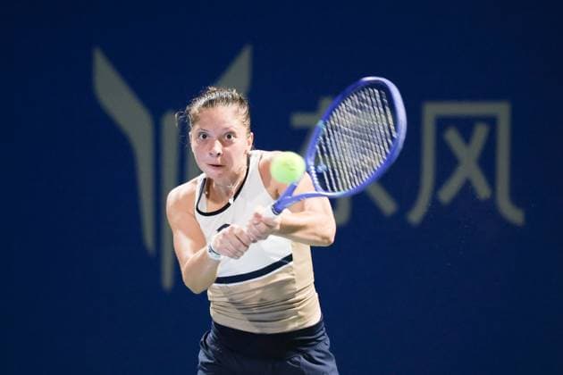 WUHAN, CHINA - OCTOBER 06: Antonia Ruzic of Croatia returns a shot in the Women s Singles Round of 64 match against Magda Linette of Poland on day 3 of 2025 Wuhan Open at Optics Valley International Tennis Center on October 6, 2025 in Wuhan, Hubei Province of China.  Copyright: xVCGx 111595440908