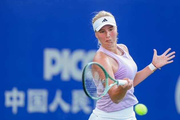 WUHAN, CHINA - OCTOBER 06: Clara Tauson of Denmark returns a shot in the Women s Singles Round of 64 match against Olga Danilovic of Serbia on day 3 of 2025 Wuhan Open at Optics Valley International Tennis Center on October 6, 2025 in Wuhan, Hubei Province of China.  Copyright: xVCGx 111595443099