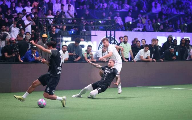Indoor soccer, The Icon League, season three, match day two at the Sporthalle Hamburg in Alsterdorf Match three Buzz Club in black against DNA Athletics Dominik Ammon at Schuss Winterhude Hamburg