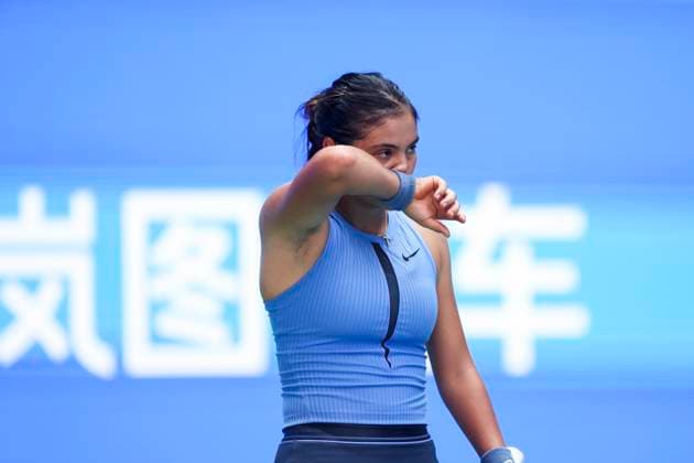 WUHAN, CHINA - OCTOBER 07: Emma Raducanu of Great Britain reacts in the Women s Singles Round of 64 match against Ann Li of United States on day 4 of 2025 Wuhan Open at Optics Valley International Tennis Center on October 7, 2025 in Wuhan, Hubei Province of China.  Copyright: xVCGx 111595637004