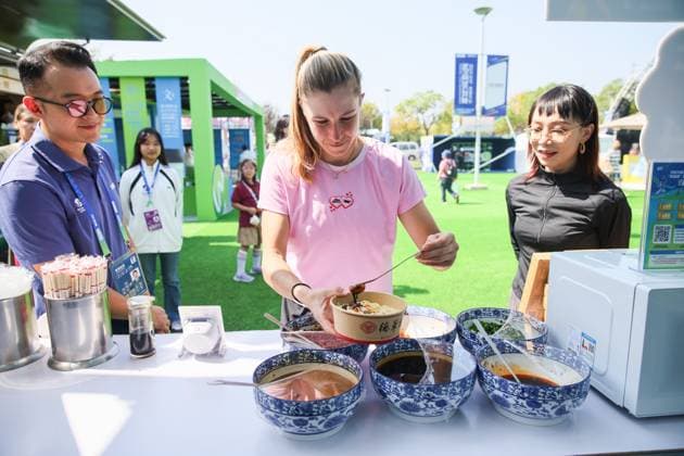 WUHAN, CHINA - OCTOBER 07: Ellen Perez (C) of Australia attends official licensed merchandise store s livestreaming event on day 4 of 2025 Wuhan Open on October 7, 2025 in Wuhan, Hubei Province of China.  Copyright: xVCGx 111595617981
