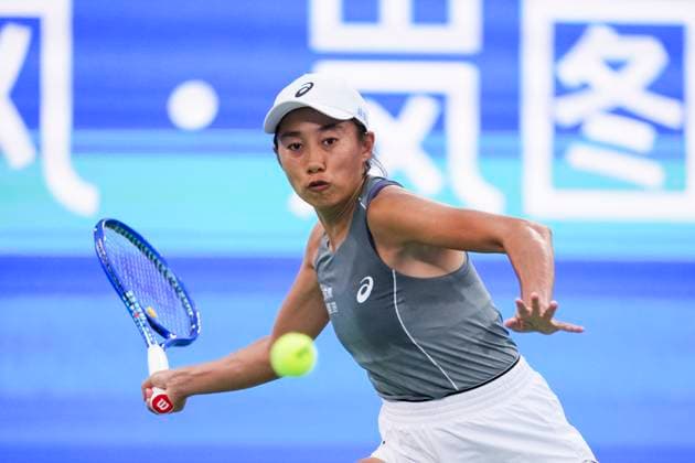 WUHAN, CHINA - OCTOBER 07: Zhang Shuai of China returns a shot in the Women s Singles Round of 64 match against Emma Navarro of the United States on day 4 of 2025 Wuhan Open at Optics Valley International Tennis Center on October 7, 2025 in Wuhan, Hubei Province of China.  Copyright: xVCGx 111595682121