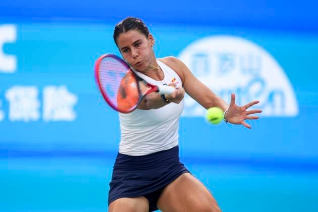 WUHAN, CHINA - OCTOBER 07: Emma Navarro of the United States returns a shot in the Women s Singles Round of 64 match against Zhang Shuai of China on day 4 of 2025 Wuhan Open at Optics Valley International Tennis Center on October 7, 2025 in Wuhan, Hubei Province of China.  Copyright: xVCGx 111595682030