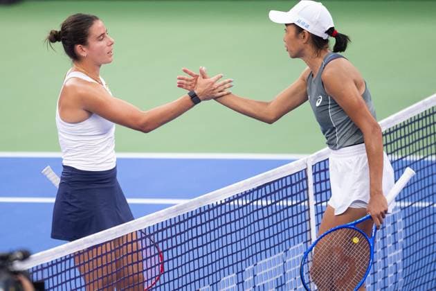 (251007) -- WUHAN, Oct. 7, 2025 -- Zhang Shuai (R) of China greets Emma Navarro of the United States after their women s singles round of 64 match at the 2025 Wuhan Open tennis tournament in Wuhan, central China s Hubei Province, Oct. 7, 2025. ) (SP)CHINA-WUHAN-TENNIS-WUHAN OPEN-WOMEN S SINGLES (CN) XiaoxYijiu 