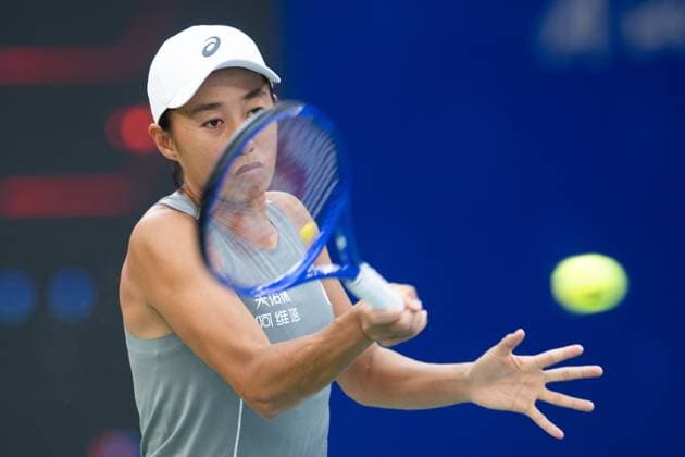 (251007) -- WUHAN, Oct. 7, 2025 -- Zhang Shuai of China hits a return during the women s singles round of 64 match against Emma Navarro of the United States at the 2025 Wuhan Open tennis tournament in Wuhan, central China s Hubei Province, Oct. 7, 2025. ) (SP)CHINA-WUHAN-TENNIS-WUHAN OPEN-WOMEN S SINGLES (CN) XiaoxYijiu 