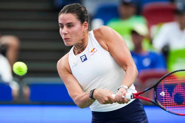 WUHAN, CHINA - OCTOBER 07: Emma Navarro of the United States returns a shot in the Women s Singles Round of 64 match against Zhang Shuai of China on day 4 of 2025 Wuhan Open at Optics Valley International Tennis Center on October 7, 2025 in Wuhan, Hubei Province of China.  Copyright: xVCGx 111595682173