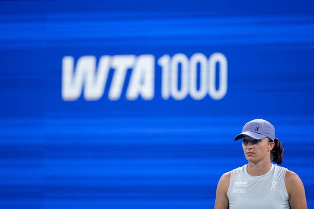 (251007) -- WUHAN, Oct. 7, 2025 -- Iga Swiatek of Poland reacts during the women s singles round of 32 match against Marie Bouzkova of the Czech Republic at the 2025 Wuhan Open tennis tournament in Wuhan, central China s Hubei Province, Oct. 7, 2025. ) (SP)CHINA-WUHAN-TENNIS-WUHAN OPEN-WOMEN S SINGLES (CN) XiaoxYijiu 