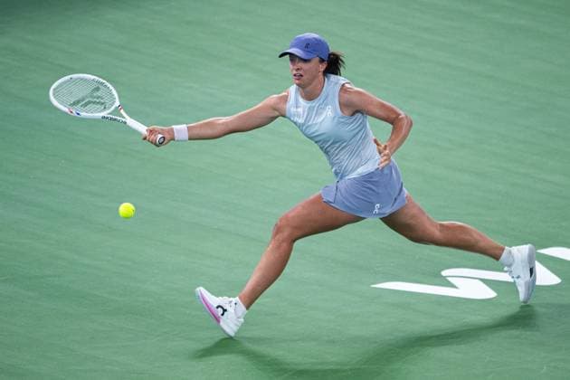 (251007) -- WUHAN, Oct. 7, 2025 -- Iga Swiatek of Poland hits a return during the women s singles round of 32 match against Marie Bouzkova of the Czech Republic at the 2025 Wuhan Open tennis tournament in Wuhan, central China s Hubei Province, Oct. 7, 2025. ) (SP)CHINA-WUHAN-TENNIS-WUHAN OPEN-WOMEN S SINGLES (CN) XiaoxYijiu 