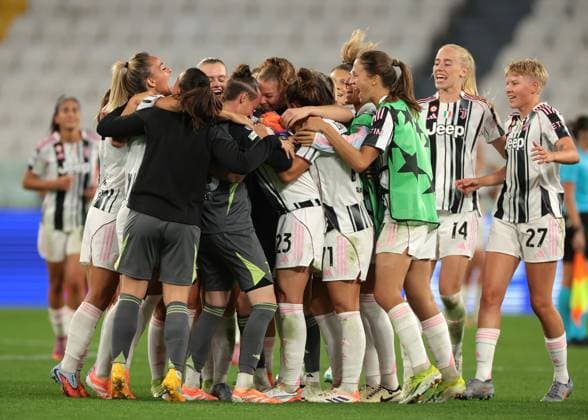 Turin, Italy, 7th October 2025. Cecilia Salvai of Juventus is mobbed by team mates following the final whistle, as her brace gave the hosts a 2-1 victory in the Juventus Women vs SL Benfica Women UEFA Womens Champions League match at Juventus Stadium, Turin. Picture credit should read: Jonathan Moscrop Sportimage EDITORIAL USE ONLY. No use with unauthorised audio, video, data, fixture lists, club league logos or live services. Online in-match use limited to 120 images, no video emulation. No use in betting, games or single club league player publications. SPI_051_JM_JUVE_BENFICA_UWCL SPI-4189-0051