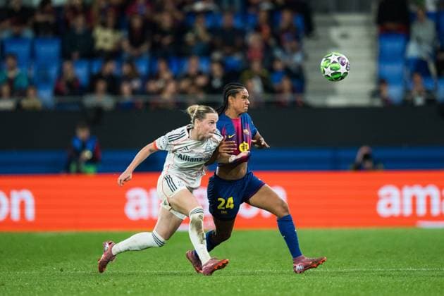 (251008) -- BARCELONA, Oct. 8, 2025 -- Esmee Brugts (R) of Barcelona vies with Magdalena Eriksson of Bayern Munich during the league phase match between FC Barcelona, Barca and Bayern Munich at the UEFA Women s Champions League in Barcelona, Spain, Oct. 7, 2025. (Photo by Xinhua) (SP)SPAIN-BARCELONA-FOOTBALL-WOMEN S CHAMPIONS LEAGUE-BARCELONA VS BAYERN MUNICH Joanxgosa 