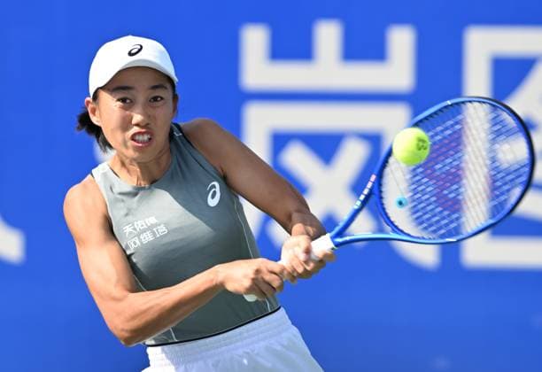 (251008) -- WUHAN, Oct. 8, 2025 -- Zhang Shuai of China returns a hit during the women s singles round of 32 match against Sorana Cirstea of Romania at the 2025 Wuhan Open tennis tournament in Wuhan, central China s Hubei Province, Oct. 8, 2025. ) (SP)CHINA-WUHAN-TENNIS-WUHAN OPEN-WOMEN S SINGLES (CN) ChengxMin 