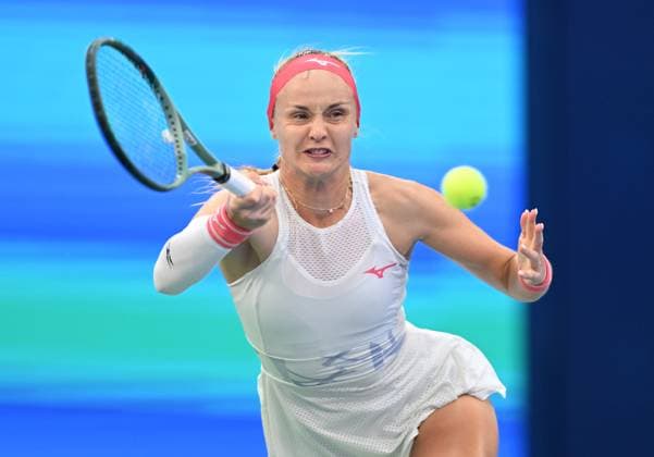 (251008) -- WUHAN, Oct. 8, 2025 -- Rebecca Sramkova of Slovakia hits a return during the women s singles round of 32 match against Aryna Sabalenka of Belarus at the 2025 Wuhan Open tennis tournament in Wuhan, central China s Hubei Province, Oct. 8, 2025. ) (SP)CHINA-WUHAN-TENNIS-WUHAN OPEN-WOMEN S SINGLES (CN) ChengxMin 