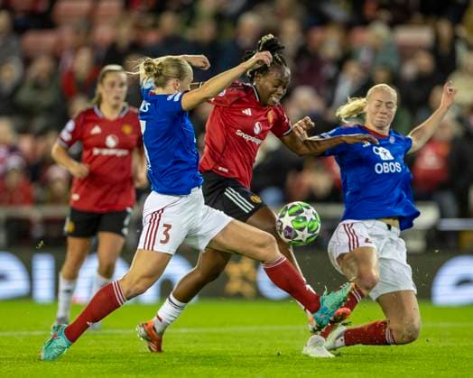 8th October 2025; Leigh Sports Village, Manchester, England; Womens Champions League Football, Manchester United, ManU versus Valerenga; Melvine Malard of Manchester United Women is tackled by Michaela Kovacs of Valerenga Fotball Damer  TimxWilliams