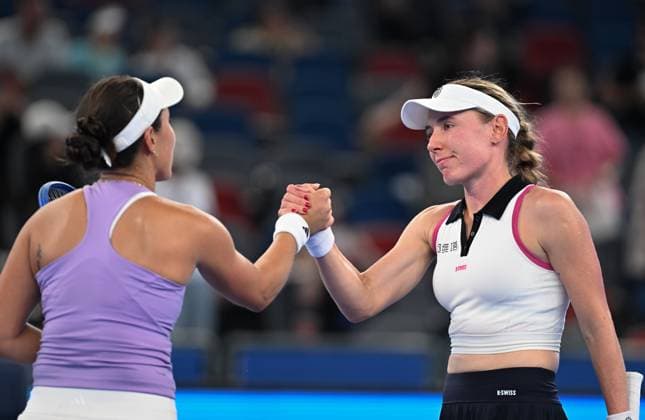 (251009) -- WUHAN, Oct. 9, 2025 -- Jessica Pegula (L) shakes hands with Ekaterina Alexandrova after the women s singles round of 16 match between Jessica Pegula of the United States and Ekaterina Alexandrova of Russia at the 2025 Wuhan Open tennis tournament in Wuhan, central China s Hubei Province, Oct. 9, 2025. ) (SP)CHINA-WUHAN-TENNIS-WUHAN OPEN-WOMEN S SINGLES (CN) ChengxMin 
