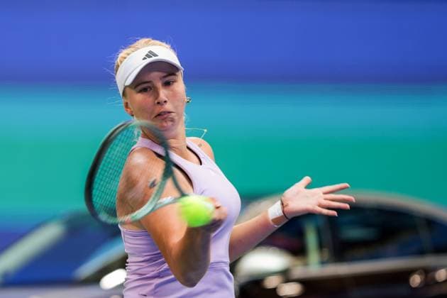 WUHAN, CHINA - OCTOBER 09: Clara Tauson of Denmark returns a shot in the Women s Singles Round of 16 match against Jasmine Paolini of Italy on day 6 of 2025 Wuhan Open at Optics Valley International Tennis Center on October 9, 2025 in Wuhan, Hubei Province of China.  Copyright: xVCGx 111596125259
