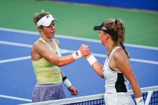 WUHAN, CHINA - OCTOBER 09: Laura Siegemund (L) of Germany shakes hands with Magdalena Frech of Poland in the Women s Singles Round of 16 match on day 6 of 2025 Wuhan Open at Optics Valley International Tennis Center on October 9, 2025 in Wuhan, Hubei Province of China.  Copyright: xVCGx 111596144674
