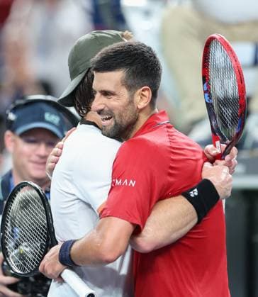 (251009) -- SHANGHAI, Oct. 9, 2025 -- Novak Djokovic (R) of Serbia hugs Zizou Bergs of Belgium after the men s singles quarterfinal at the ATP, Tennis Herren World Tour Shanghai Masters tennis tournament in Shanghai, east China, Oct. 9, 2025. ) (SP)CHINA-SHANGHAI-TENNIS-ATP TOUR-SHANGHAI MASTERS-MEN S SINGLES (CN) DingxTing 