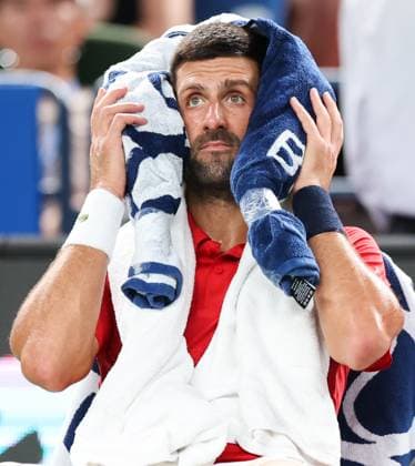 (251009) -- SHANGHAI, Oct. 9, 2025 -- Novak Djokovic takes a break during the men s singles quarterfinal between Novak Djokovic of Serbia and Zizou Bergs of Belgium at the ATP, Tennis Herren World Tour Shanghai Masters tennis tournament in Shanghai, east China, Oct. 9, 2025. ) (SP)CHINA-SHANGHAI-TENNIS-ATP TOUR-SHANGHAI MASTERS-MEN S SINGLES (CN) DingxTing 