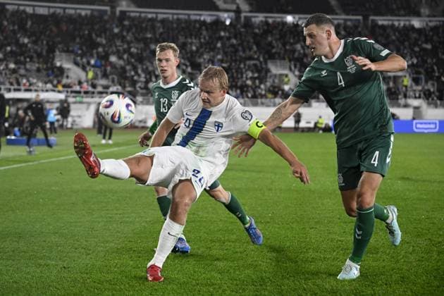 20 Joel Pohjanpalo of Finland and 13 Justas Lasickas and 4 Edvinas Girdvainis of Lithuania fights for the ball during the 2026 FIFA World Cup, WM, Weltmeisterschaft, Fussball qualification UEFA Group G football match Finland vs Lithuania in Helsinki, Finland on October 9, 2025. Helsinki Finland LKFTJK20251009195233MVMN  Copyright: xMarkkuxUlanderx LKFTJK20251009195233MVMN