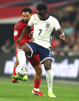 Jay Dasilva of Wales and Bukayo Saka of England in action England v Wales, International Friendly, Länderspiel, Nationalmannschaft Football, Wembley Stadium, London, UK - 09 Oct 2025London Wembley Stadium United Kingdom EDITORIAL USE ONLY No use with unauthorised audio, video, data, fixture lists, club league logos or live services. Online in-match use limited to 120 images, no video emulation. No use in betting, games or single club league player publications. Copyright: xKieranxMcManus Shutterstockx 15522902y