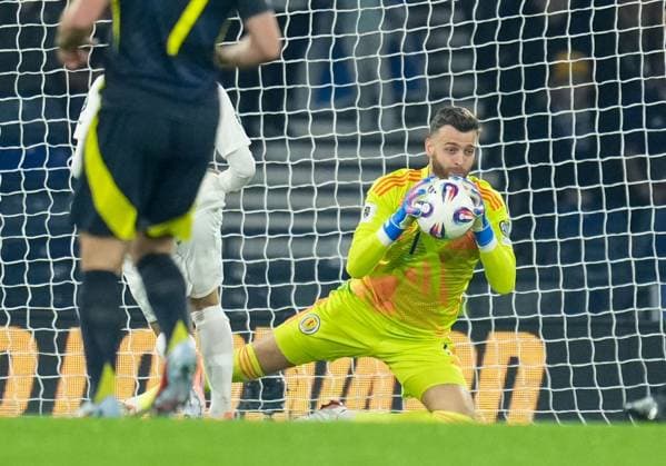 Scotland goalkeeper Angus Gunn under pressure from Christos Tzolis of Greece after a poor pass from Aaron Hickey of Scotland. Scotland v Greece, FIFA 2026 World Cup Qualifying, Group C, Football, Hampden Park, Glasgow, Scotland, UK - 09 Oct 2025Glasgow Hampden Park United Kingdom EDITORIAL USE ONLY No use with unauthorised audio, video, data, fixture lists, club league logos or live services. Online in-match use limited to 120 images, no video emulation. No use in betting, games or single club league player publications.  Copyright: xStuartxWallace Shutterstockx 15522896an