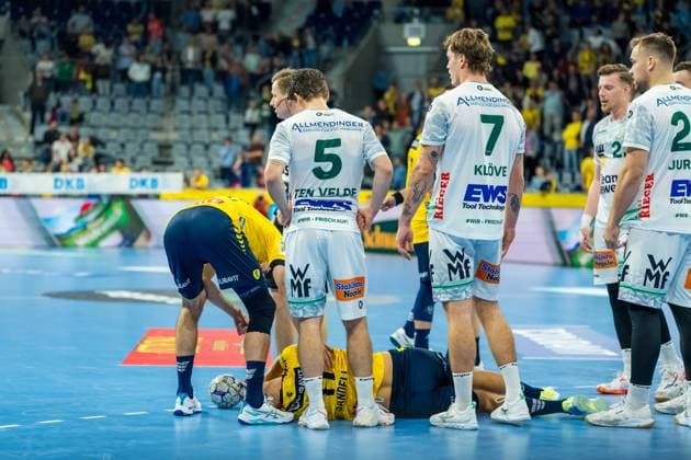 Lukas Sandell 11, Rhein Neckar Löwen injured on the floor Erik Persson 22 FAG and Ludvig Jurmala 25 FAG on injury Copyright: xSpeedshotx