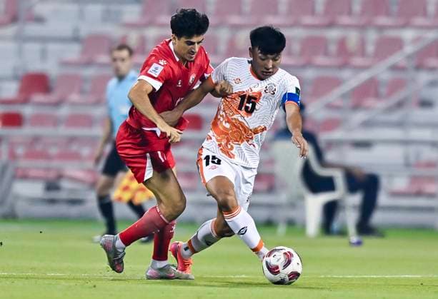 LEBANON v BHUTAN-AFC ASIAN CUP 2027 QUALIFIER THIRD ROUND Husseyn Chakroun (L) of Lebanon and Nima Wangdi of Bhutan in action during the AFC Asian Cup 2027 Qualifier third round Group B match between Lebanon and Bhutan at Grand Hamad Stadium in Doha, Qatar, on October 9, 2025. DOHA Qatar Copyright: xNOUSHADx